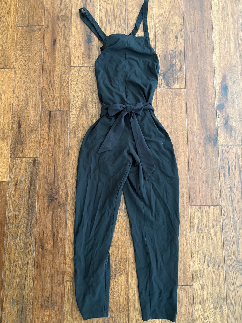 of an origin organic cotton black stretchy jumpsuit for pregnancy and postpartum